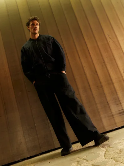 Black track pants, styled look